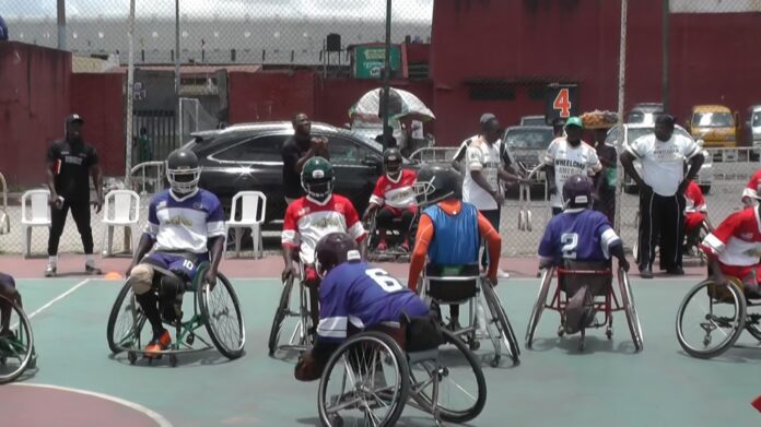 Nigeria_wheelchair_American_football_players_on_the_court Athletes in action during a recent wheelchair American Football game in Lagos, Nigeria. Photo: Marabou News Agency